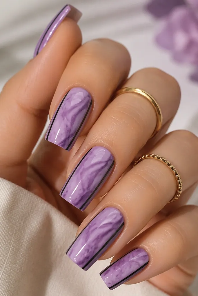 Nails have a soft purple marble background; each nail has a black frame line along both side edges, with glossy finish.