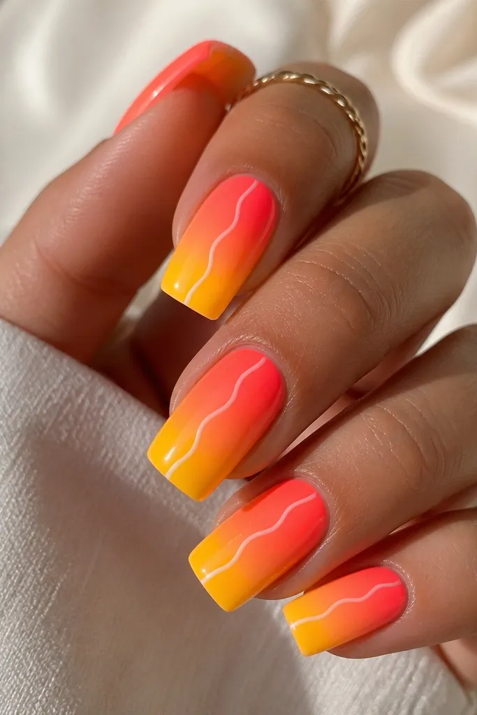 Square nails with a smooth gradient from neon coral at the cuticle to mango yellow at the tip. A thin white squiggle line runs vertically down the middle of each nail, with glossy top coat.