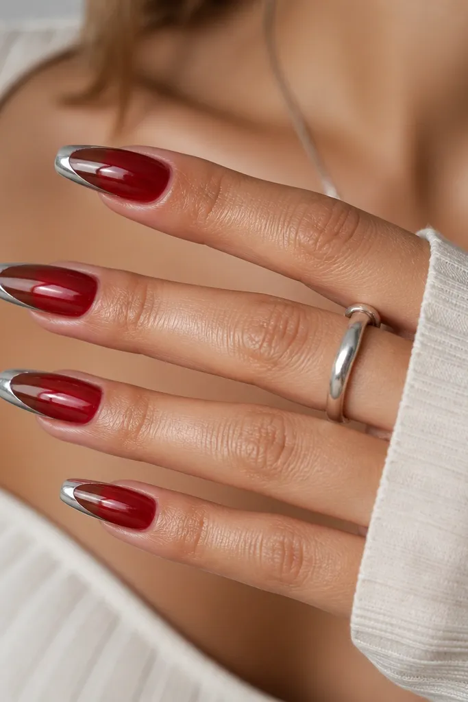 Medium coffin nails with a red jelly base and silver chrome French tips, glossy and dimensional.