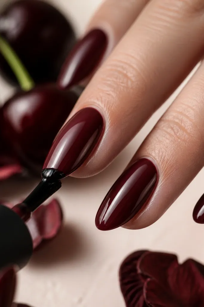 Nails with a smooth glossy finish; the free edge is coated and the underside of the tip is lightly sealed, shown by a consistent shine at the edge.