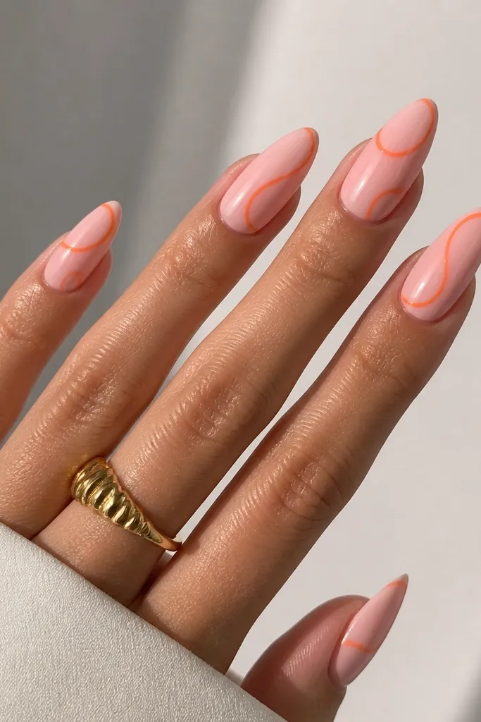 Almond nails with a glossy pink milk base and a looping tangerine orange swirl starting near the cuticle and curving toward the outer tip; thin line detail, clean edges.
