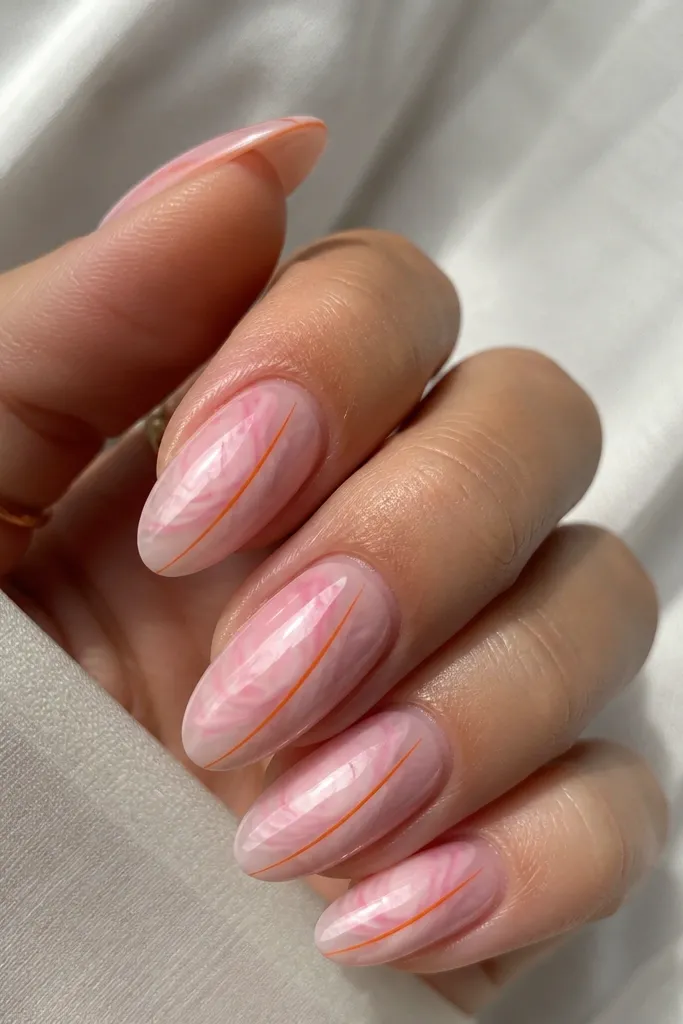 Almond nails with pink marble swirls and a single thin orange micro stripe running diagonally down the nail; glossy finish.