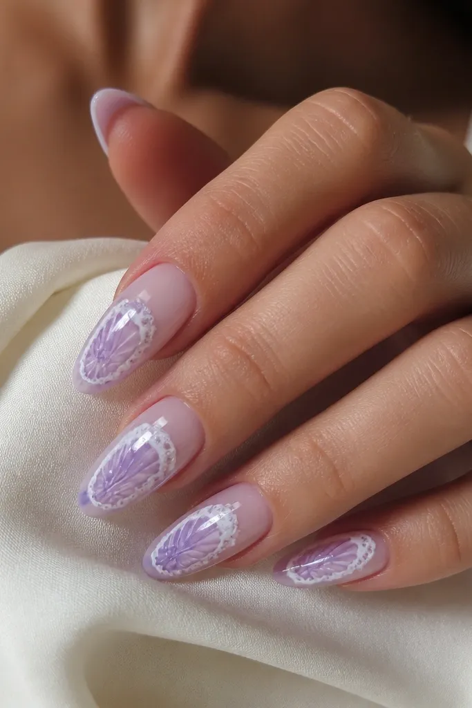 Long almond nails. Base is sheer nude with a faint purple tint. A purple seashell decal sits on each nail, and over it there is a hand-painted milky white foam edge that follows the decal outline. Glossy topcoat.