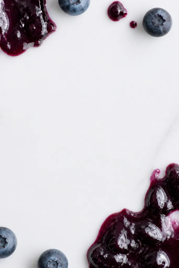 Deep blueberry purple accent shapes with lots of clear negative space in the center; glossy top coat makes the jam look thick.
